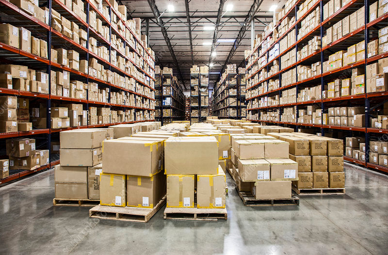 F0220694-Racks_holding_boxes_of_product_on_pallets_in_warehouse.jpg